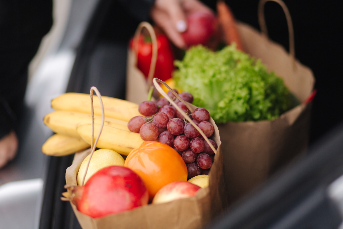 Grocery bags full of fruit and vegetables