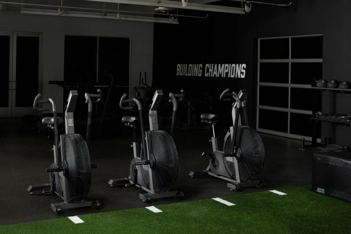 Hammer Strength HD Air Bikes lined up in gym