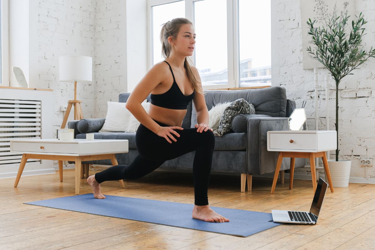 Woman working out at home on a yoga mat