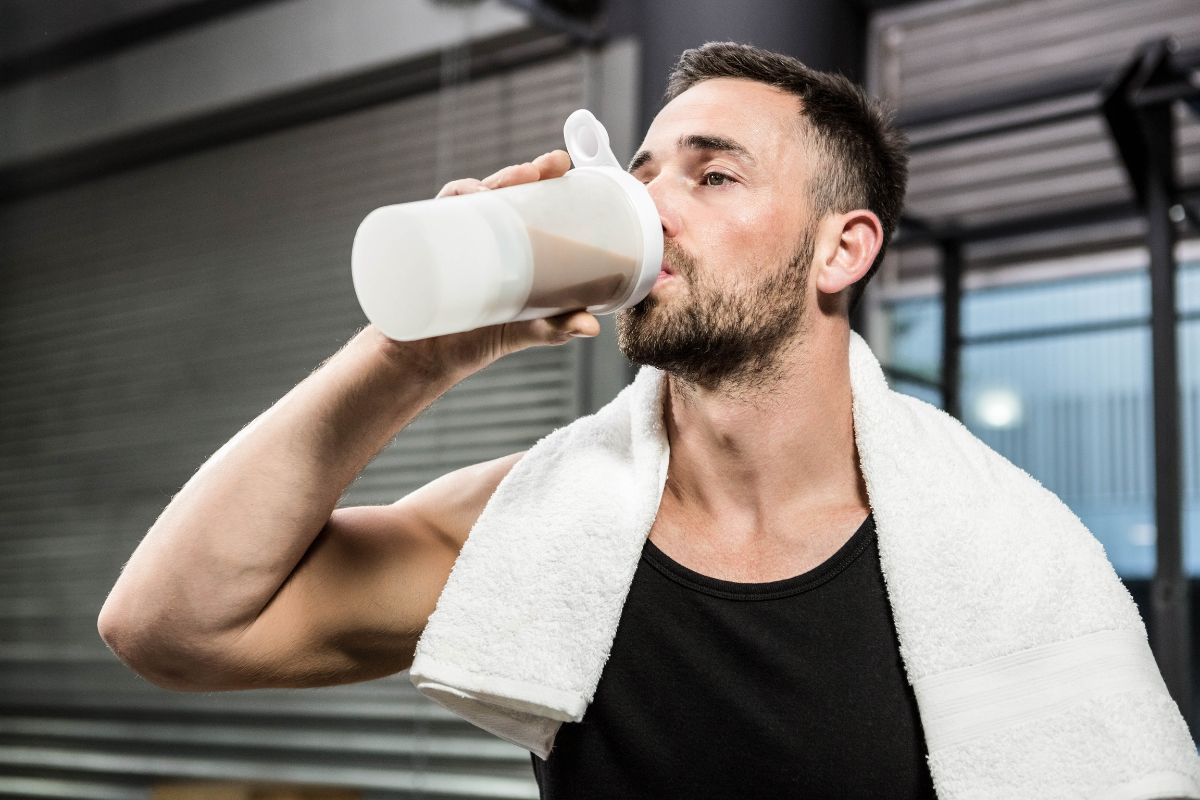 Man sipping a protein shake 